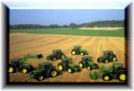 Picture of John Deere tractors in large field