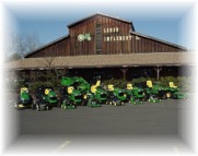 Picture of JD Compact Tractors in front of Lenon Implement